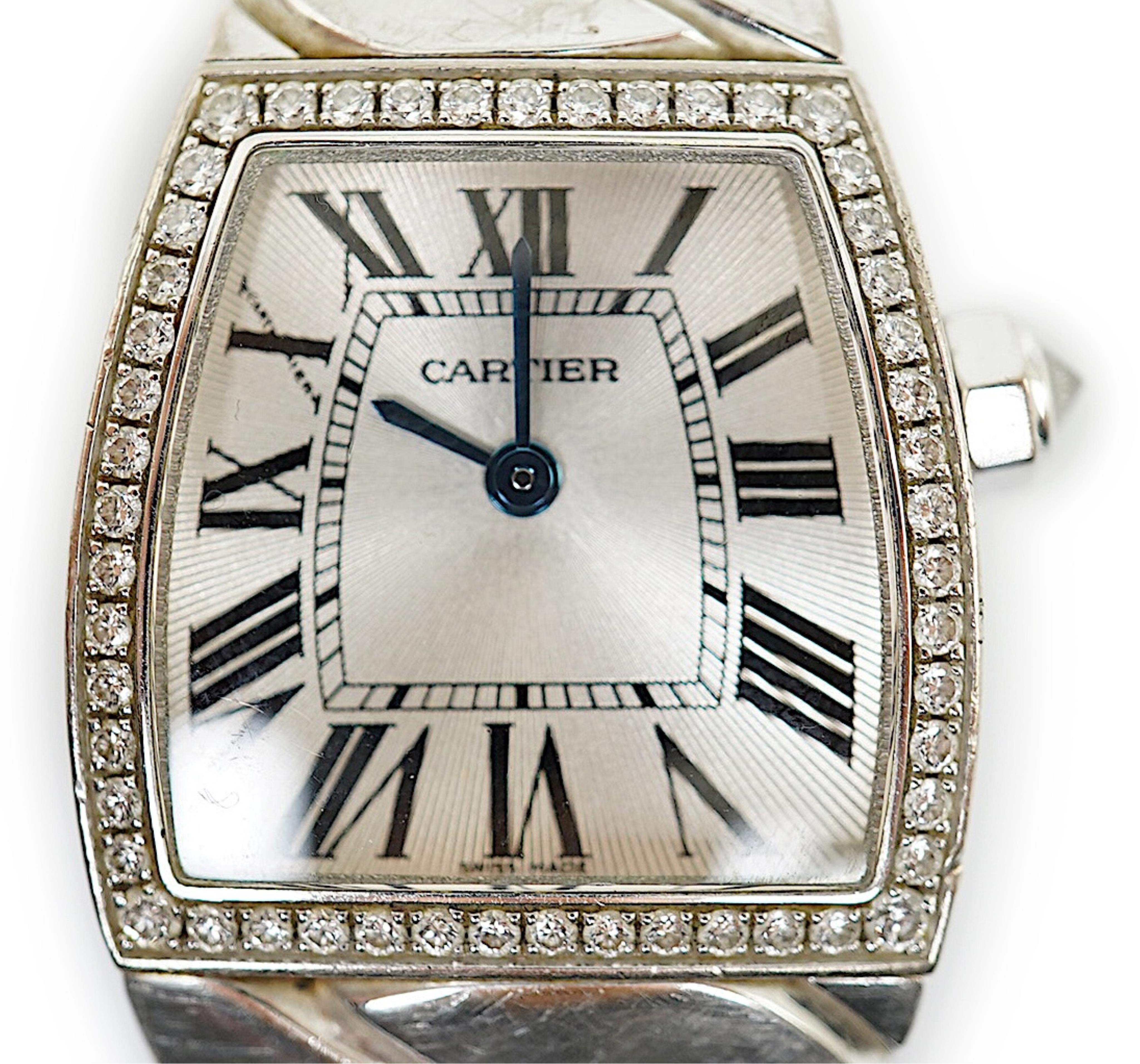 A lady's recent 18ct white gold and diamond set Cartier La Dona quartz wrist watch, on an 18ct white gold Cartier bracelet